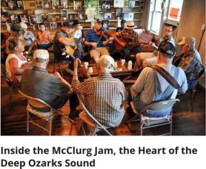 Photographed during a Monday-night jam session, a McClurg Jam group. In a circle are people playing various instruments together.