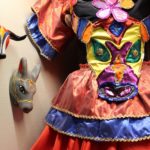 The dress, a tribute to Congo dances, features a bodice appliqué of El torito (the bull), a popular carnaval character.