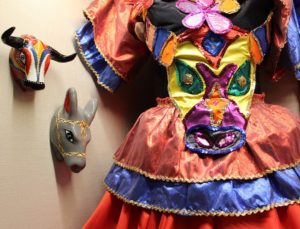 The dress, a tribute to Congo dances, features a bodice appliqué of El torito (the bull), a popular carnaval character.