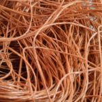 Close up photo of hay bale twine, the orange tinted twine is long and spiraly.