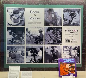 Photo of an exhibit case with images of ten apprenticeship teams plus titles and logos.