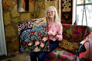 Woman poses on chair with floral textile