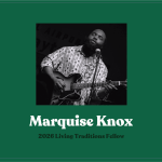 A performance shot of Knox with guitar