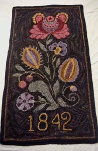 Vertical floral hooked rug
