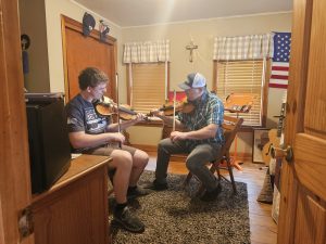 Fiddlers practicing at home. 
