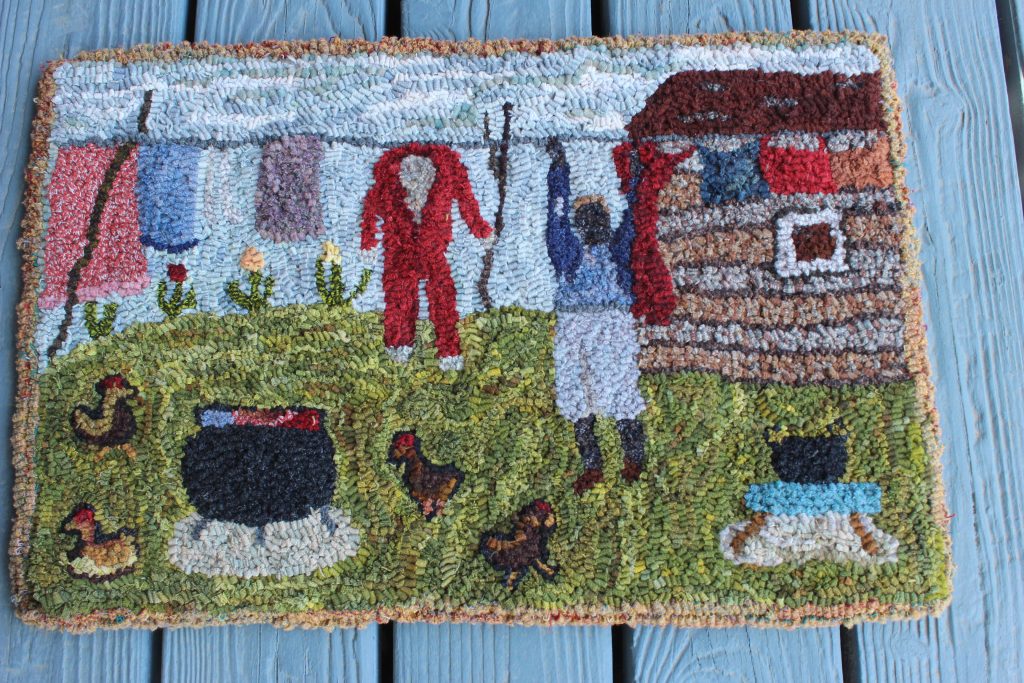 Rug depicts hanging laundry outside.